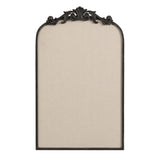 Tall arched pinboard with beige fabric surface framed in dark wood, topped with ornate carved scrollwork detail.
