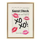Framed cream canvas featuring a restaurant guest check print with black 'XO XO!' text and four pink lipstick kiss marks scattered around.