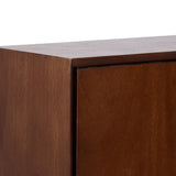 Close-up of a corner detail of the McCutcheon Floating Bathroom Cabinet showing its smooth brown wood finish and minimalist, handle-less door design.