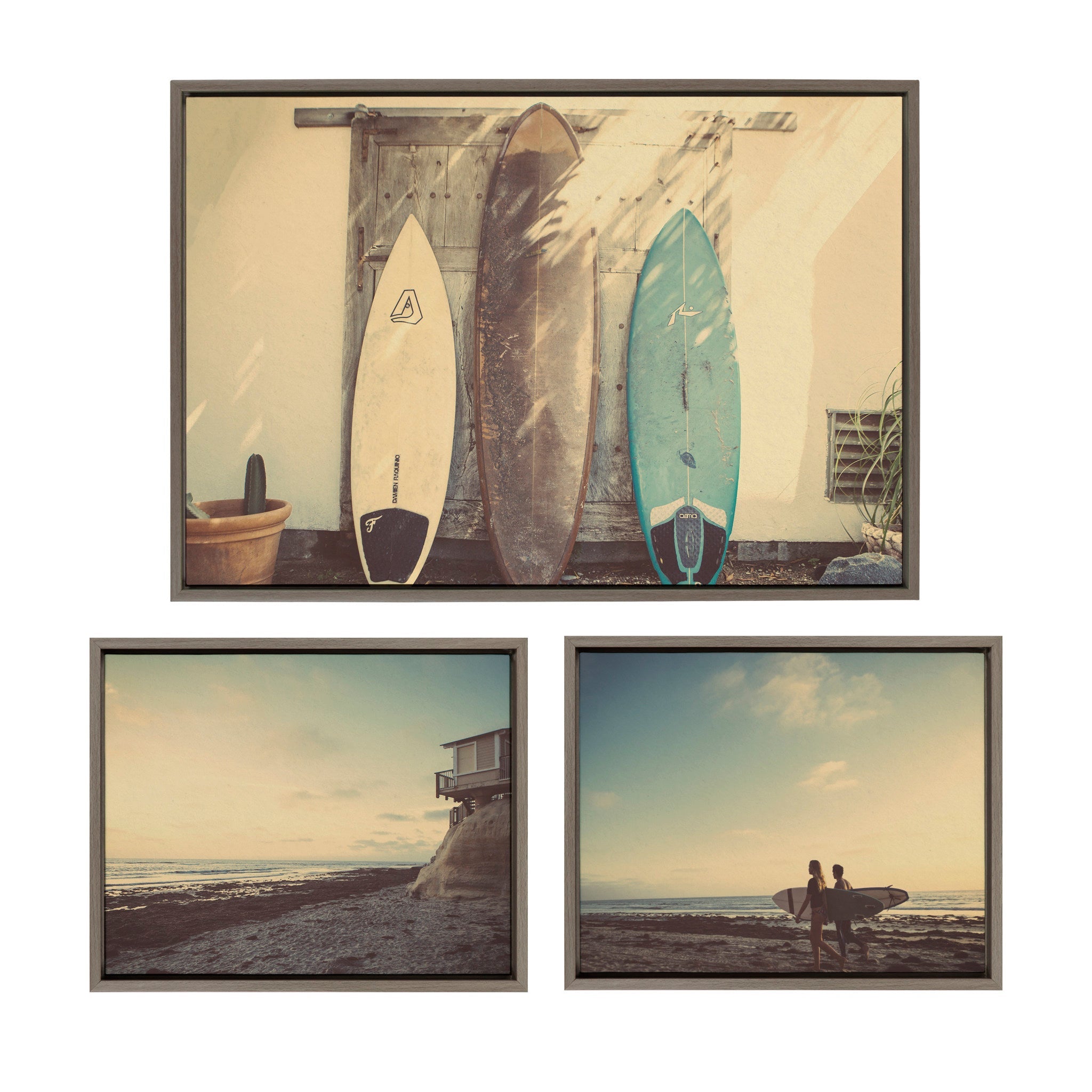 Framed canvas art set showing a house on the beach, surfboards, and surfers in gray polystyrene frames
