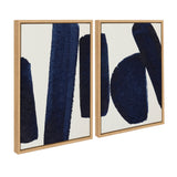 Two framed canvases with bold, textured navy blue brushstrokes on a white background, showcasing minimalist abstract art in natural wood frames.