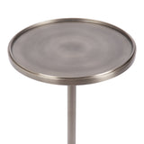 Round polished metal table top with a smooth, slightly brushed surface and a thin raised edge, supported by a single cylindrical central leg in matching finish.
