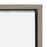 Close-up of a grey wood frame holding a white stretched canvas with visible fabric texture in the corner.