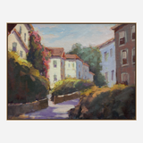 Impressionist-style painting of a sunlit village street lined with white and reddish buildings, green foliage, and shadows cast on the path under a blue sky.
