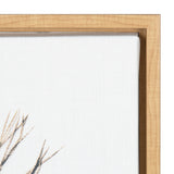 Close-up of a corner of a wooden frame with light natural wood grain, holding white canvas with faint feather details in beige and black brushstrokes.