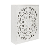 White carved wood wall cabinet with ornate floral and circular patterns on the door, shown in an angled view highlighting depth and detailed craftsmanship.