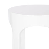 Close-up of a smooth, white round table top with a single arched leg in a minimalist design against a white background