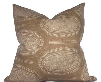 Kamba Pillow Cover in Sand laying on sofa with luxurious linen texture