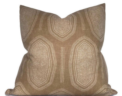 Kamba Pillow Cover in Sand on a chair with visible sand-colored front and ivory linen back