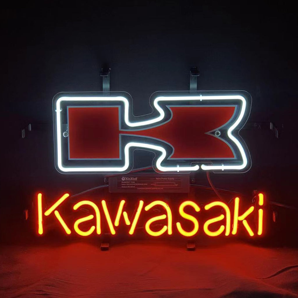 Neon sign displaying a stylized red and white logo above bright red neon text spelling 'Kawasaki' on a dark background.