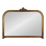 Rectangular wall mirror with a rounded top edge, surrounded by a carved antique gold frame featuring a central ornamental crest and beaded detailing along edges.