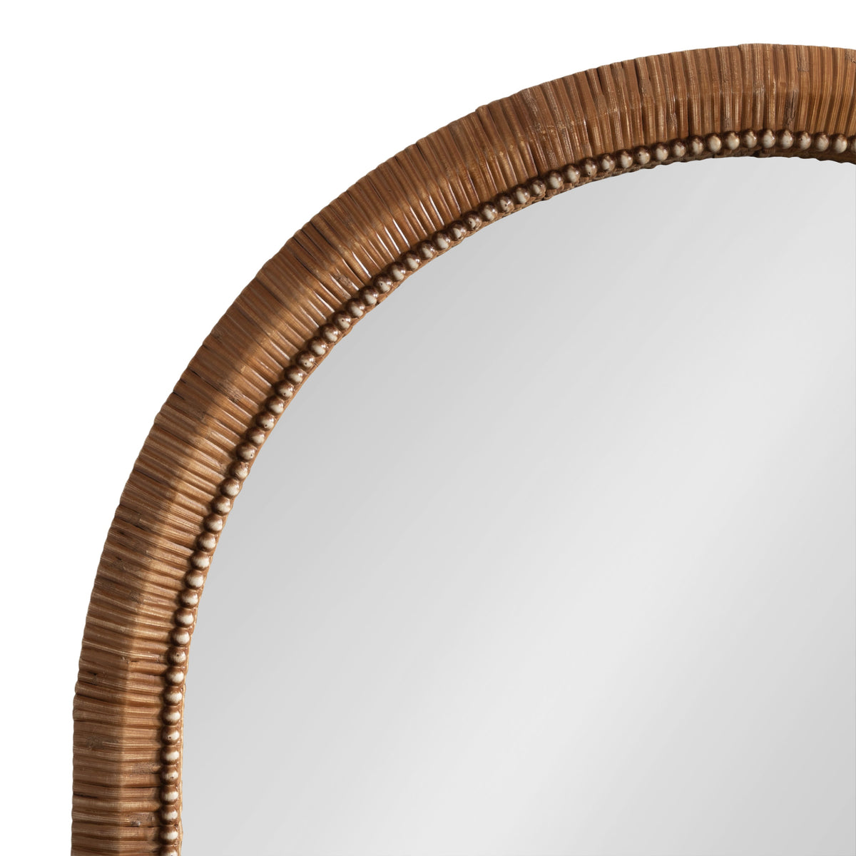 Arched wall mirror with a carved wooden frame featuring vertical ridges and a line of small round wooden beads along the inner edge.