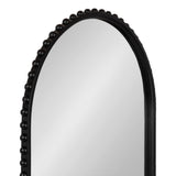 Arched black wall mirror with a frame decorated by evenly spaced large black beads along the arch's curve on a white background.