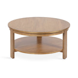 Round wooden coffee table with smooth surface and lower shelf, supported by three straight legs in warm brown finish.