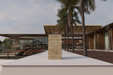 Tall rectangular travertine marble side table with a horizontal LED strip near the top, shown outdoors on a white surface with palm trees and modern architecture in the background.