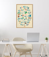 Framed alphabetical poster with colorful science-themed illustrations and words like Atom, Fossil, Galaxy, Magnet, and Telescope on a cream background.