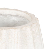 Close-up of a white ceramic planter with a scalloped edge and textured vertical ridges, featuring a smooth inner surface with slight glossy finish.