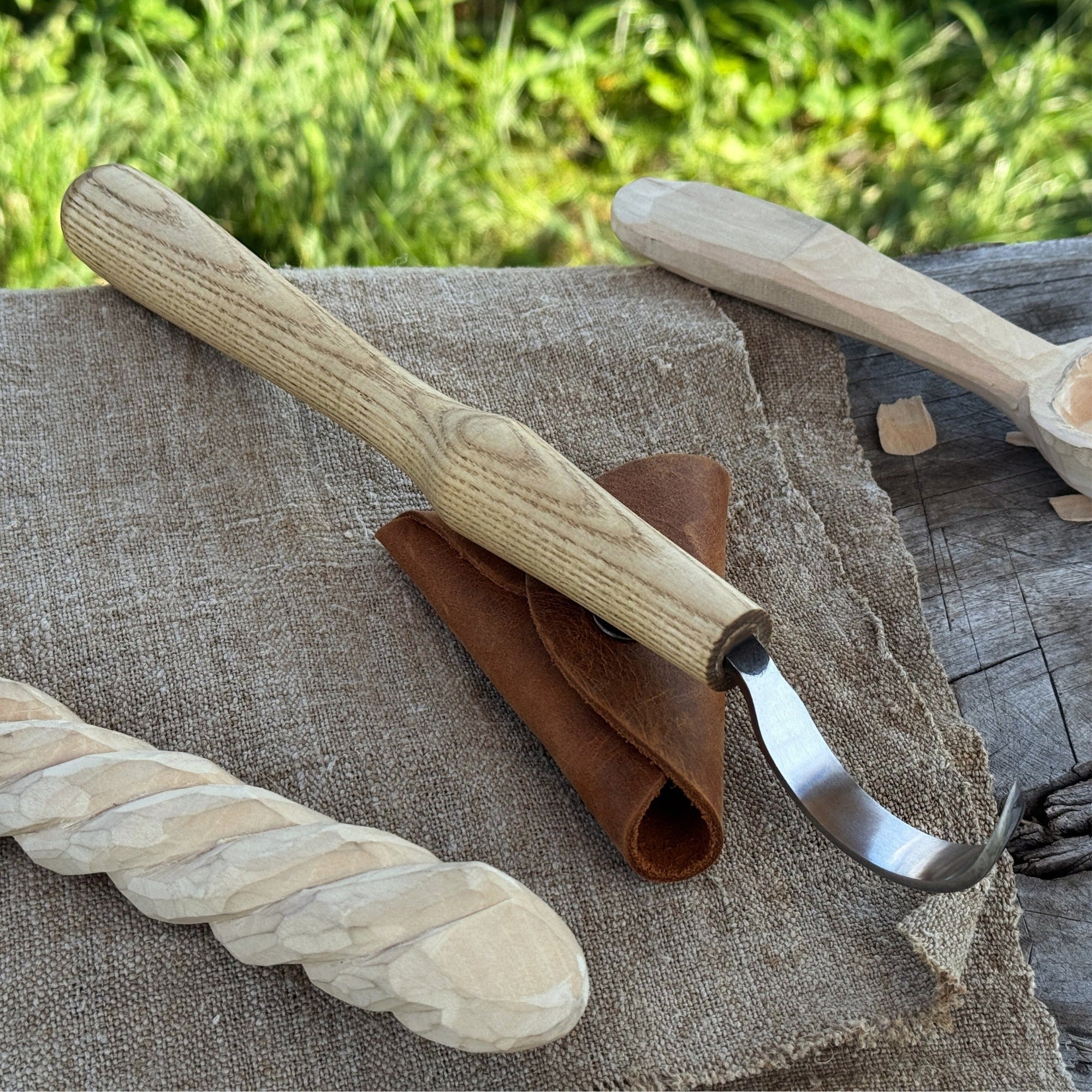 Large hook knife for spoon carving with ash wood handle and protective leather case