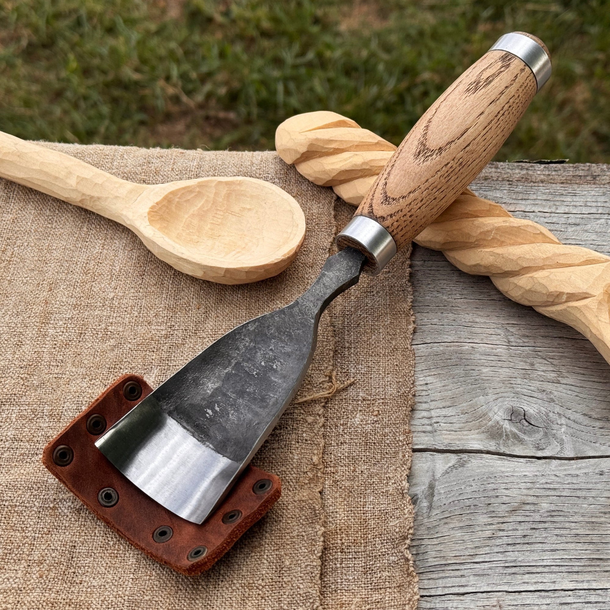 Large straight gouge rounded chisel with ash wood handle and carbon steel blade