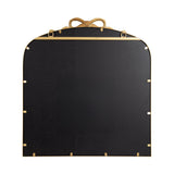 Arched rectangular mirror with black backing and thin gold metal frame, featuring a decorative gold ribbon bow detail at the top center.