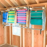 Lawn Chair Organizing Stud Mounted Hooks mounted on a garage wall holding stacked lawn chairs