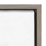 Close-up of a framed canvas corner with a natural wood frame and tightly stretched white canvas, showing canvas texture and smooth wood grain.