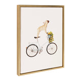 Framed canvas art depicting a light brown French Bulldog standing on the seat of a pastel blue bicycle with a basket of yellow flowers against a white background.