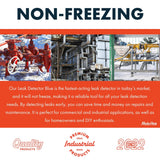 Red industrial valves and piping outdoors with snow, alongside a complex network of metal pipes inside an industrial facility.