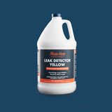 White plastic gallon jug with handle containing Made Here Leak Detector Yellow, featuring a dark blue and orange label with product details