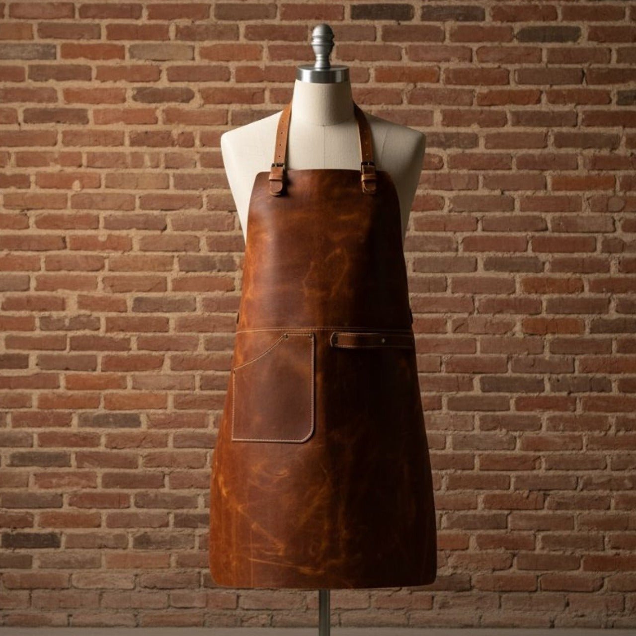 Handcrafted leather work apron with adjustable straps and front pockets by Sharky Forged Steel Tools