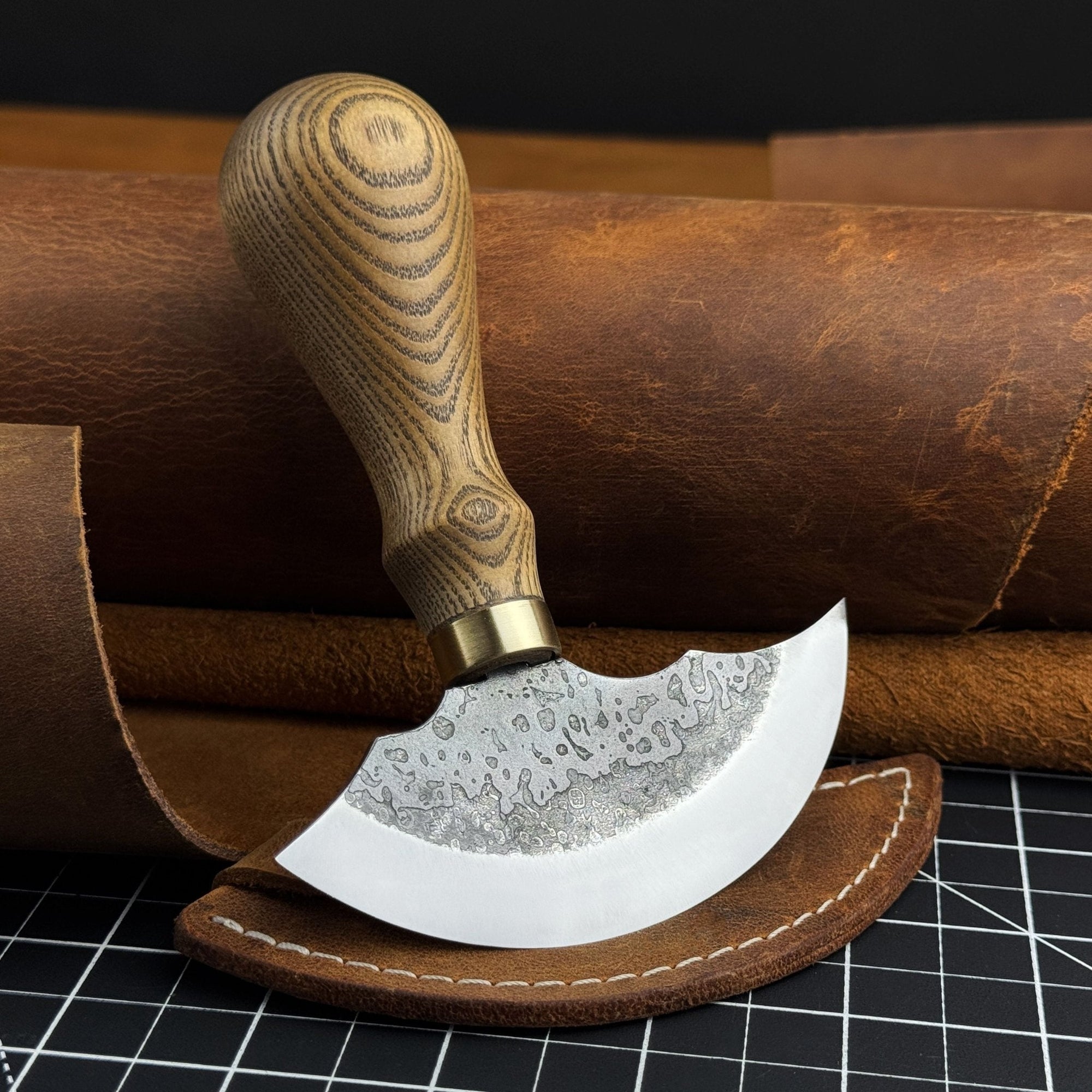 Hand-forged leather round knife with ash wood handle and carbon steel blade