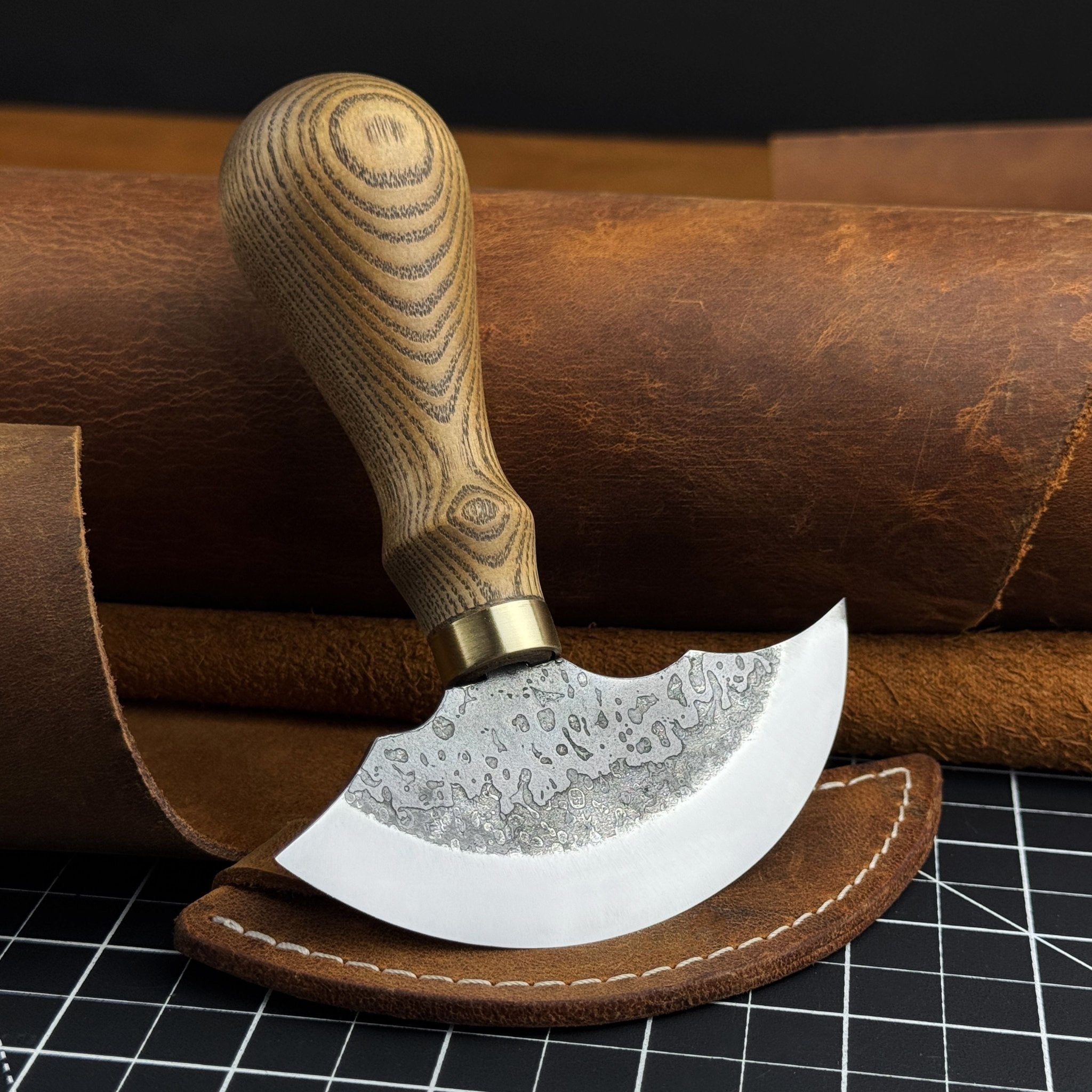 Hand-forged leather round knife with ash wood handle and carbon steel blade