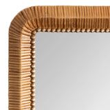 Close-up of a rectangular mirror corner with a ribbed wooden frame featuring a beaded inner edge in natural wood tones.
