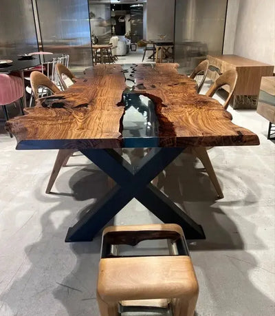 Live edge chestnut wood dining table with epoxy resin river and black legs
