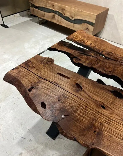 Live edge chestnut wood dining table with epoxy resin river and black legs