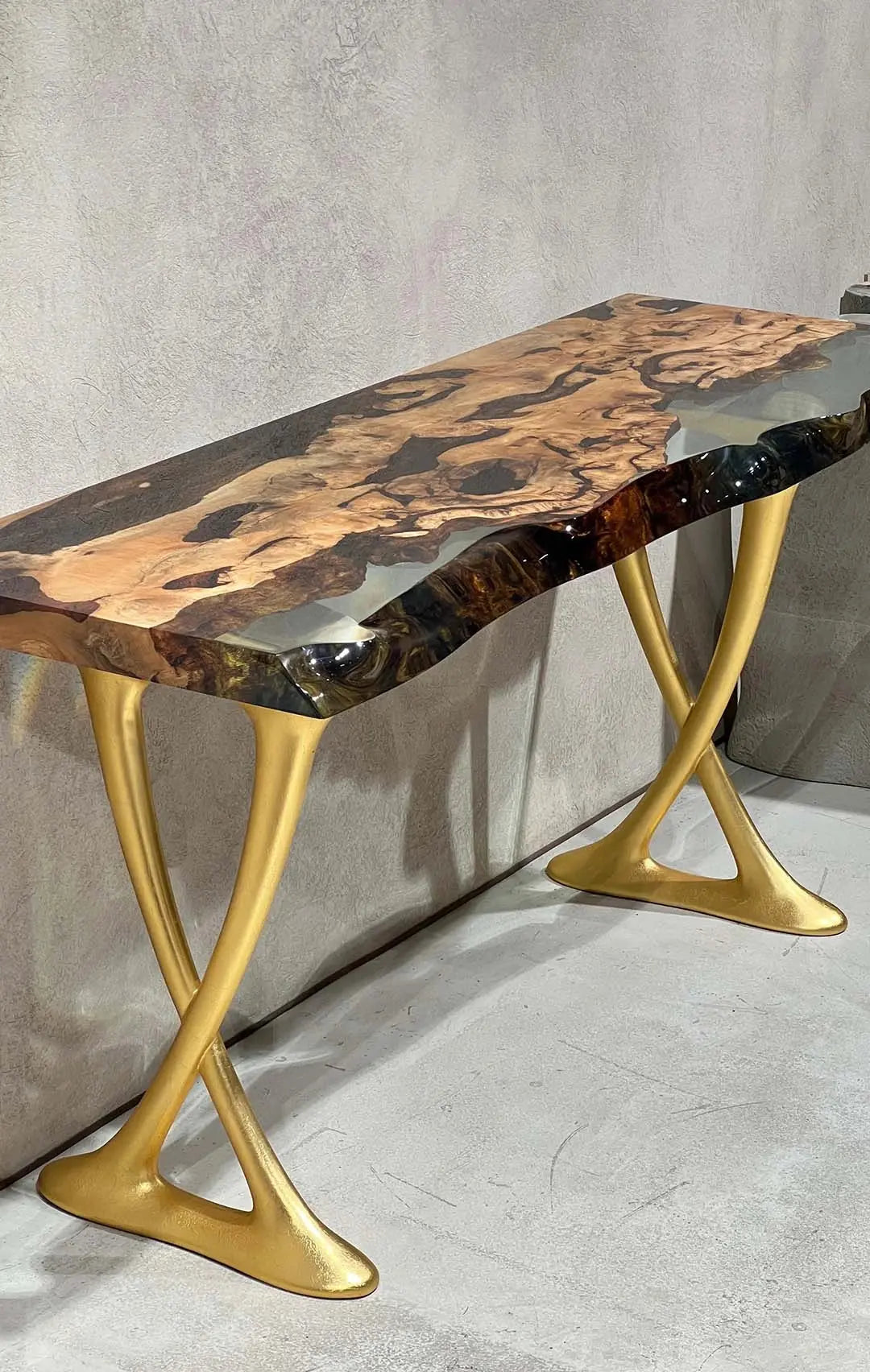 Handcrafted resin live edge console table made of aged linden wood with aluminum legs in a foyer setting