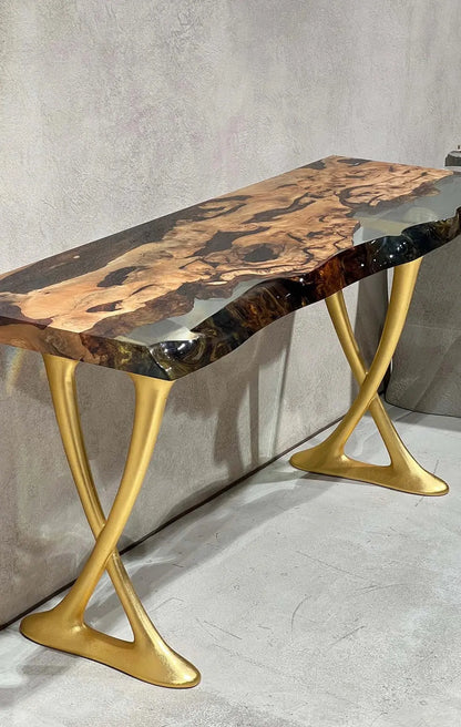 Handcrafted resin live edge console table made of aged linden wood with aluminum legs in a foyer setting