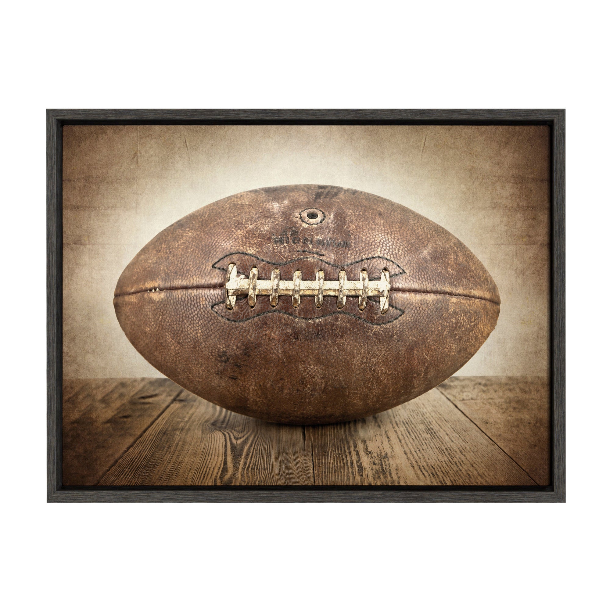 Sylvie Vintage Football framed canvas art in a modern floating polystyrene frame, shown hung on a wall.