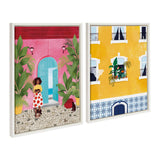 Two framed canvas artworks: one features a woman in a white skirt with red flowers standing by a pink and turquoise building entrance with green plants; the other shows a yellow building facade with blue patterned tiles and potted