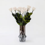 Long Stem White Roses arranged loosely showing full white rose blooms with long green stems