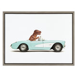 Side view of a small brown T. rex toy driving a light aqua 1957 Corvette convertible against a white background in a thin gray frame.