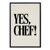 Framed canvas featuring bold black lettering stating 'YES, CHEF!' on a white background with a thin black frame.