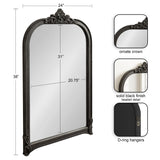 Tall arched wall mirror with ornate crown and beaded black frame measuring 38 by 24 inches, featuring D-ring hangers on the back for mounting.