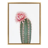 Framed canvas art featuring a vertical green cactus with long pink spines and a large, soft pink flower blooming at the top against a white background.