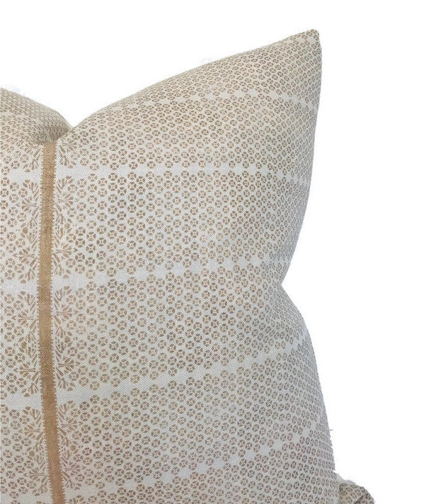 Cream-colored pillow cover with a sand brown intricate geometric and floral pattern, featuring a vertical central seam detail.