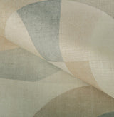 Close-up of textured fabric pillow cover with overlapping semi-circles in muted beige, parchment, and pale blue colors.