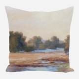 Square pillow with a painted landscape showing a marsh scene featuring muted green trees and brown grasses under a soft beige sky.