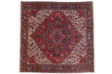 Square Mehrivan carpet with red central medallion, intricate geometric patterns, and contrasting cream background framed by dark red floral borders.