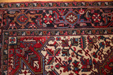Close-up of a 9.5x10 vintage Mehrivan square carpet showing intricate red, navy, cream, and blue patterns with floral and geometric motifs.