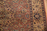 Section of a vintage 5.5x8 Romanian Tabriz carpet featuring intricate floral and vine patterns in rust, beige, navy, and black tones with decorative border design.